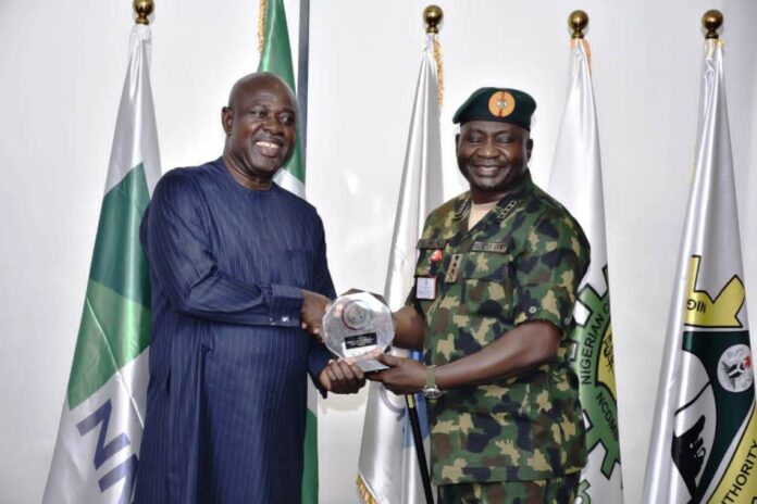 Petroleum Ministry Collaborates with Military1 Minister of State Petroleum Resources (Oil), Sen. Heineken Lokpobiri, receiving a Plaque from Chief of Defence Staff, Gen. Christopher Musa during the courtesy visit.