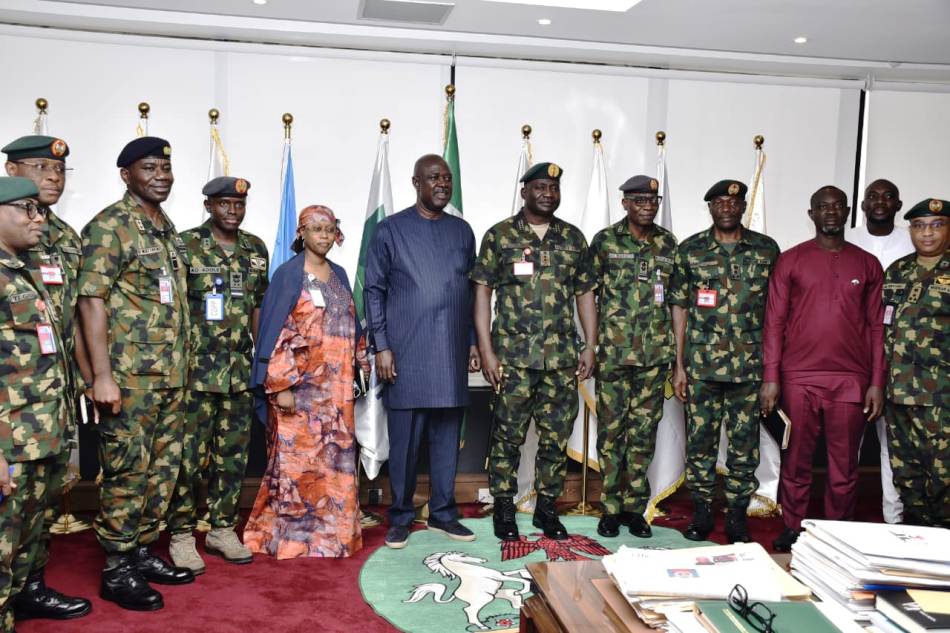 Minister of State Petroleum Resources (Oil), Sen Heineken Lokpobiri (M) in a group photograph with the Chief of Defence Staff (CDS), Gen. Chris. Musa, aides of the Minister and other members of the military hierarchy who came with the CDS