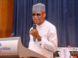 The Honourable Minister of Sports Development Senator John Owan-Enoh delivering his key note address at the 2024 inaugural African Sports and Tourism Award ceremony held at Congress Hall Transcorp Hilton Hotels Abuja