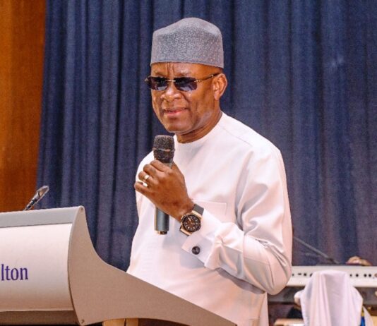 The Honourable Minister of Sports Development Senator John Owan-Enoh delivering his key note address at the 2024 inaugural African Sports and Tourism Award ceremony held at Congress Hall Transcorp Hilton Hotels Abuja