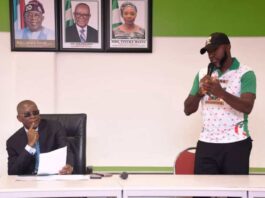 The Honourable Minister of Sports Development, Senator John Owan-Enoh being addressed by the Secretary Unity Schools Old Students Association, Anthony Anene Chidi, when the Association paid him a courtesy visit in his office recently.