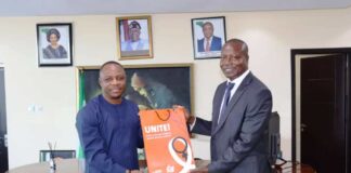 L - R: Permanent Secretary, Federal Ministry of Women Affairs, Ambassador Gabriel Aduda, receiving a Souvenir from the Acting Deputy Country Representative of UN Women, Zephania Aura, when the latter led a delegation on a courtesy visit to the Ministry today