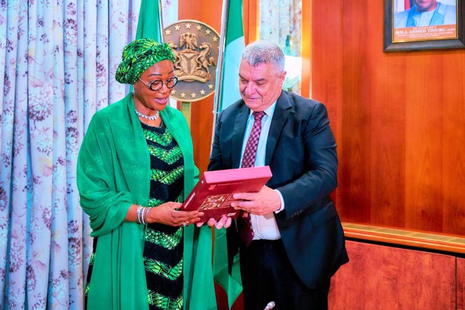 First Lady of the Federal Republic of Nigeria Senator Oluremi Tinubu receiving a gift from the Ambassador of the Republic of Turkey to Nigeria Hidayet Bayraktar after he paid a courtesy visit to her office at the State House Abuja on Thursday 9th May 2024