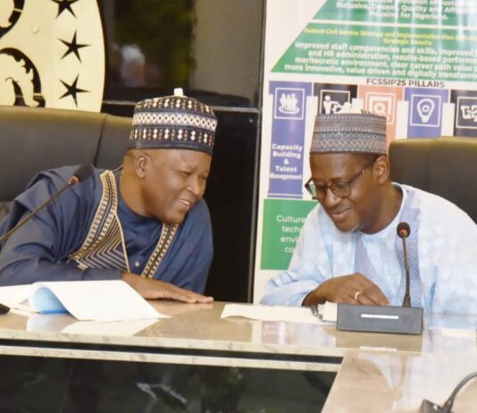 Minister and Minister of State, Housing & Urban Development, Arch Ahmed Dangiwa and Abdullahi Tijjani Gwarzo during a meeting with members of Renewed Hope Multipurpose Cooperative Society