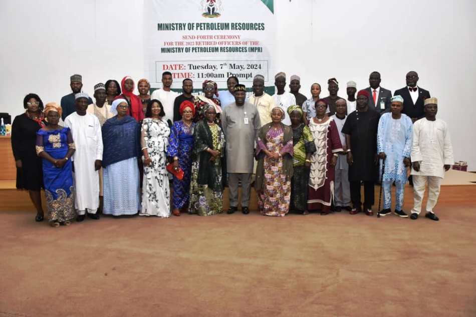 The Permanent Secretary, Ministry of Petroleum Resources, Amb. Nicholas Agbo Ella (Centre)flanked by the Directors and Heads of Departments and Units in the Ministry in a group photograph with the year 2023 retired officers of the Ministry.