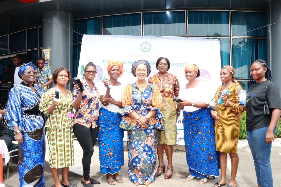 Honourable Minister of Women Affairs, Barrister (Mrs) Uju Kennedy-Ohanenye and some beneficiaries of the POS machines