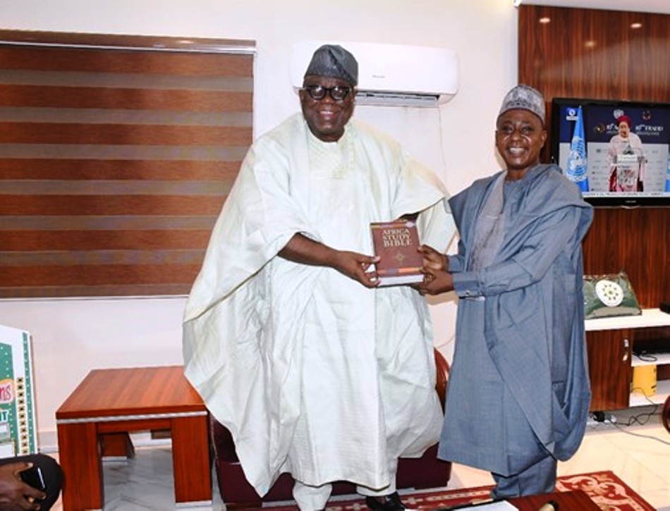 Hon. Chairman FCSC, Prof. Tunji Olaopa (L) with Dr. Simon Dolly, Federal Commissioner representing North Central at Nigeria Christian Pilgrim Commission at the event.