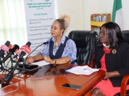 Honourable Minister of Women Affairs, Barrister (Mrs) Uju Kennedy-Ohanenye addressing journalists at the briefing. To her left is the Director, Women Development Department, Mrs. Funke Oladipo