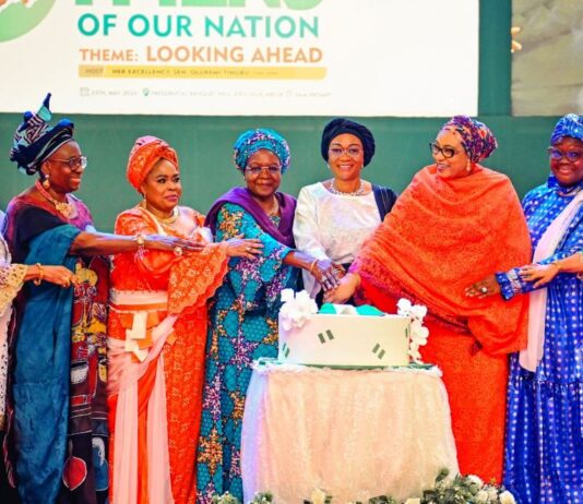 L-R Former Minister, Chief Mrs Nike Akande, wife of former president, Mrs Bola Obasanjo, Former First Lady, Dame Patience Jonathan, Former First Lady, Mrs Victoria Gowon, the First Lady of the Federal republic of Nigeria Senator Oluremi Tinubu, wife of the Vice President Hajia Nana Shettima and wife of the Senate President Mrs Ekaette Akpabio cutting the cake at an event tagged Celebrating the Mothers of our nation in commemoration of the First Anniversary of the Administration of President Bola Ahmed Tinubu held in Abuja on Saturday 25th May