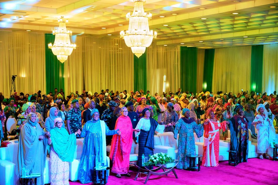 Cross section of guests with the First Lady of the Federal republic of Nigeria, Senator Oluremi Tinubu, cutting the cake at an event tagged Celebrating the Mothers of our nation in commemoration of the First Anniversary of the Administration of President Bola Ahmed Tinubu held in Abuja on Saturday 25th May