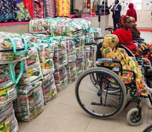 Some of the beneficiaries of the Food bags distributed by the Renewed Hope Initiative, RHI to vulnerable groups and persons across the 44 local government areas of Kano state on Thursday 23rd May