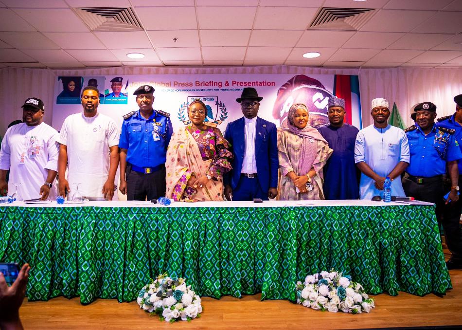 Hon. Minister of State for Youth Development, Ayodele Olawande (middle) with other dignitaries at the launch of "Young and Secure" at the State House, Abuja.