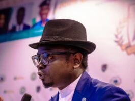 Hon. Minister of State for Youth Development, Ayodele Olawande presenting his speech at the launch of "Young and Secure" at the State House.