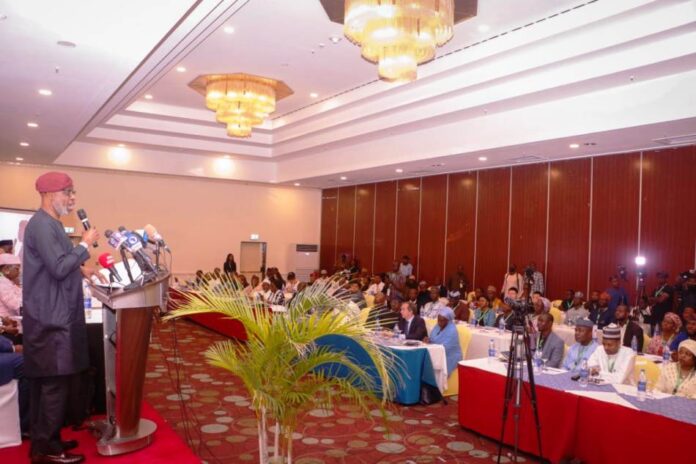 Hon Minister for Solid Minerals Development Dr Dele Alake addressing participants at the Mining Conference organized by the Nigerian Institute of Policy & Strategic Studies NIPPS.