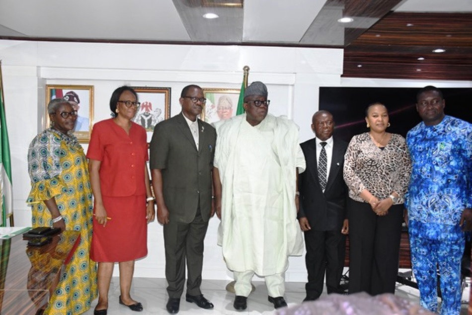 Hon. Chairman FCSC, Prof. Tunji Olaopa (R) with the President and Chairman of Council, Mr. Dominic Omokaro (immediate Left) flanked by (L & R) by the Executive Members of the association.