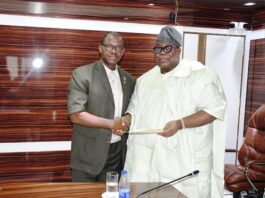 Hon. Chairman FCSC, Prof. Tunji Olaopa (R) with Nigeria Library Association’s President and Chairman of Council, Mr. Dominic Omokaro paid him a courtesy call.