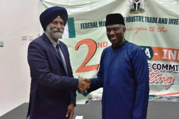 Nigeria-India Joint trade meeting1 Permanent Secretary Federal Ministry of Industry, Trade and Investment, Amb. Nura Abba Rimi and in a handshake with the leader of Indian Delegation to Nigeria Mr. Amardeep Sigh Bathia, at Second Nigeria-India, joint trade committe meetings in Abuja on Monday.