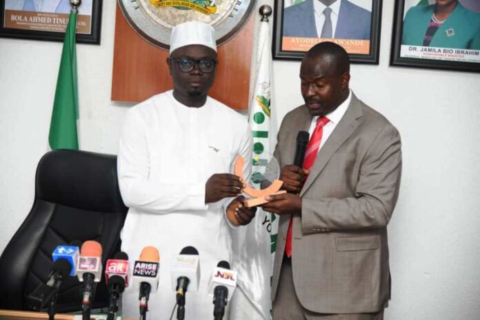 Nigerian Youths1 Leader of Delegation , African-Arab Youth Council, Dr Abbas Agaba Mugisha (right) presenting a plaque to the Hon. Minister of State for Youth Development, Ayodele Olawande during their courtesy call on the Minister.