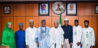 The Hon. Minister of Budget and Economic Planning Sen. Abubakar A. Bagudu, the Permanent Secretary FMBEP to his right, the Kaduna State Commissioner for Planning and Budget Commission Hon. Muktar Ahmed left, of the Minister flanked by senior management staff of the State Commission in the Minister's office yesterday.