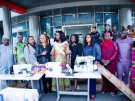 4th from left - Honourable Minister of Women Affairs, Barrister (Mrs) Kennedy-Ohanenye, House of Representatives member representing Langtang North and South Constituency, Beni Lar; Director, Women Development Department, Federal Ministry of Women Affairs, Mrs Funke Oladipo and other dignitaries with some of the empowerment machines for distribution to various States of the Federation