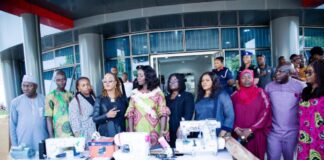 4th from left - Honourable Minister of Women Affairs, Barrister (Mrs) Kennedy-Ohanenye, House of Representatives member representing Langtang North and South Constituency, Beni Lar; Director, Women Development Department, Federal Ministry of Women Affairs, Mrs Funke Oladipo and other dignitaries with some of the empowerment machines for distribution to various States of the Federation