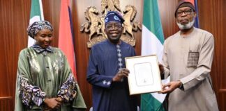Minister of Solid Minerals Development, Dr. Dele Alake presenting the gold bar document to President Bola Tinubu at the State House, Abuja recently. With them is the Executive Secretary, Solid Minerals Development Fund, Mrs Fatimah Shinkafi.