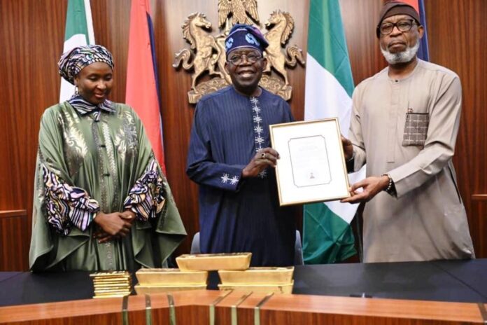 Alake Presents Gold Bars To President Tinubu Minister of Solid Minerals Development, Dr. Dele Alake presenting the gold bar document to President Bola Tinubu at the State House, Abuja recently. With them is the Executive Secretary, Solid Minerals Development Fund, Mrs Fatimah Shinkafi.