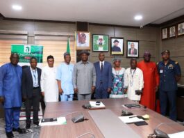 Hon. Minister of Aviation and Aerospace Development, Festus Keyamo & Permanent Secretary, Dr. Emmanuel Meribole in a group photograph with the newly inaugurated Ministerial Task Force on illegal Private operations and related matters