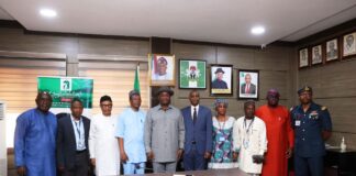 Hon. Minister of Aviation and Aerospace Development, Festus Keyamo & Permanent Secretary, Dr. Emmanuel Meribole in a group photograph with the newly inaugurated Ministerial Task Force on illegal Private operations and related matters