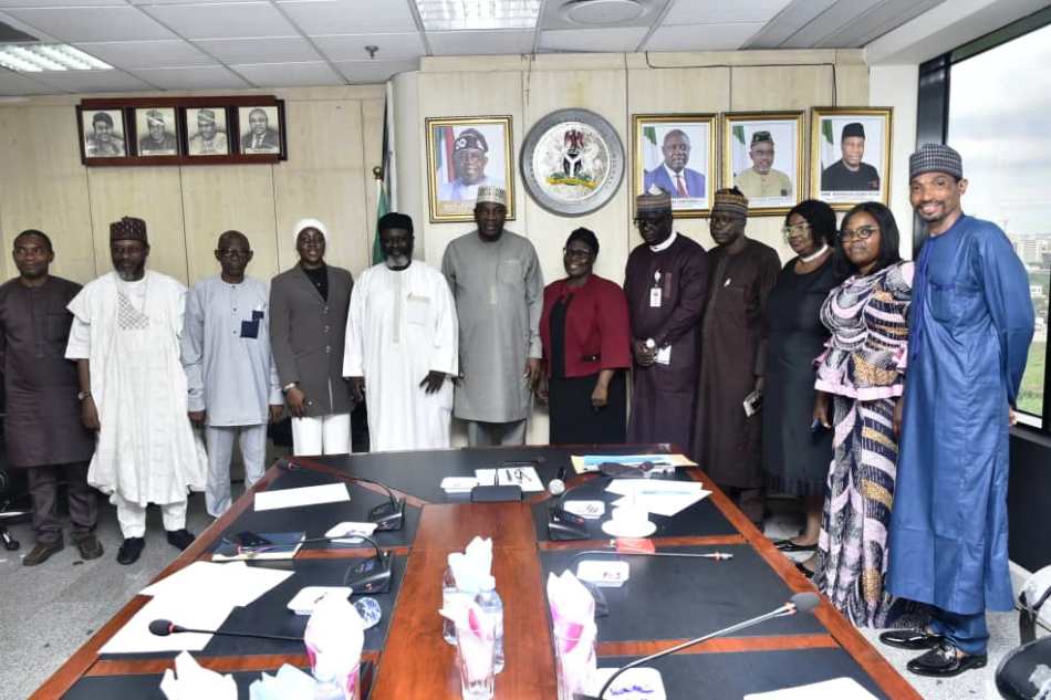 Permanent Secretary, Ministry of Petroleum Resources, Amb. Nicholas Agbo Ella in a group photograph with some Directors in the Ministry and the FOSSREA delegation after the agreement signing ceremony in Abuja