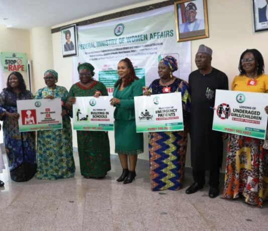 5th from left - Honourable Minister of Women Affairs, Barrister (Mrs) Uju Kennedy-Ohanenye and some Stakeholders with samples of the signposts designed for hotels, schools and hospitals during the Partnership Meeting