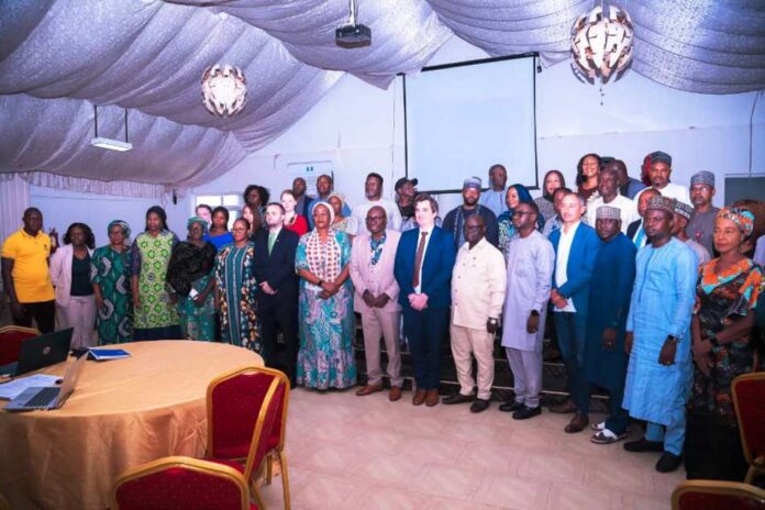 Humanitarian Ministry Pledges Effective Coordination And Policy Formulation (Front row, 8th right) Representative of the Permanent Secretary Federal Ministry of Humanitarian Affairs and Poverty Alleviation, the Director Humanitarian Affairs FMHAPA, Valentine Ezulu (7th right) Representative of IOM, Daniel Salmon (6th right) Executive Secretary SEMA Benue State, (5th Right) Representative of ActionAid Nigeria, David Habba, (4th Right) Emergency Officer, World Food Programme, Christian Keilbach, (8th left) Assistant Director Humanitarian Affairs FMHAPA, Barbara Dele-Oye (7th left) First Secretary Embassy of Switzerland Nicolas Martin Achard (5th left) Head Press and Public Relations Unit, FMHAPA, Rhoda Ishaku Iliya, and other participants at the 7th National Humanitarian Coordination Technical Working Group (NHCTWG) meeting held on Wednesday 26th June 2024, in Abuja.