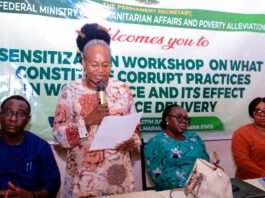 (Standing) Representative of the Permanent Secretary Federal Ministry of Humanitarian Affairs and Poverty Alleviation, the Director, Planning, Research and Statistics, Patienc N. Oyekunle, delivering a keynote address at the sensitization workshop on What Constitute Corruption in the Work Place, organized for Ministry's SERVICOM Desk Officers, held in Mararaba, Nasarawa State