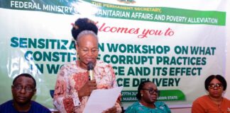 (Standing) Representative of the Permanent Secretary Federal Ministry of Humanitarian Affairs and Poverty Alleviation, the Director, Planning, Research and Statistics, Patienc N. Oyekunle, delivering a keynote address at the sensitization workshop on What Constitute Corruption in the Work Place, organized for Ministry's SERVICOM Desk Officers, held in Mararaba, Nasarawa State