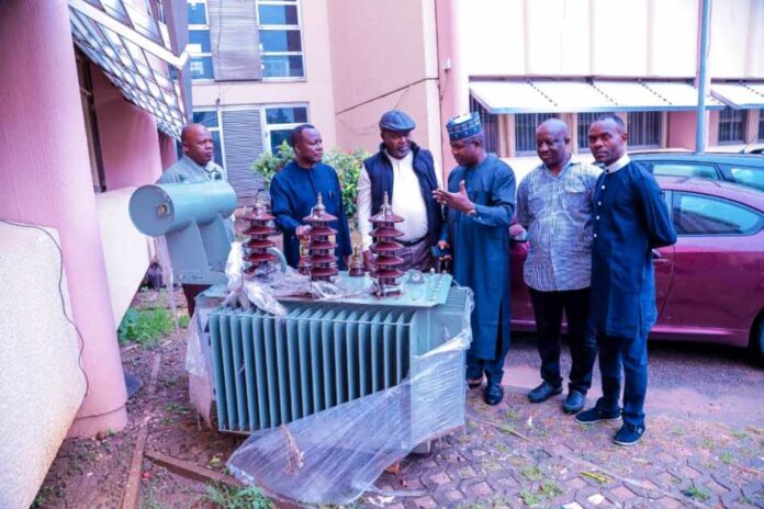 (2nd left) Director General Services Federal Ministry of Humanitarian Affairs and Poverty Alleviation, Yakubu John (4th left) Agabus Datukum and other officials of the Ministry during the hand over of the 500KVA transformer to the Ministry by the ICPC