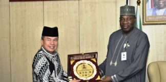 Permanent Secretary, Ministry of Petroleum Resources, Amb. Nicholas Agbo Ella, presenting a souvenir to the Indonesian Ambassador, Usra Hendra Harahap, during his visit to the Ministry.