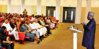 The Permanent Secretary, Ministry of Petroleum Resources, Amb. Nicholas Agbo Ella (right) addressing the Directors and other members of Staff of the Ministry at the Town Hall meeting today 27th June, 2024 in Abuja.