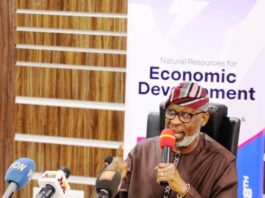 Creating Awareness on the Forthcoming Africa Natural Resources and Energy Investment Summit (3rd Edition AFNIS 2024): The Honourable Minister of Solid Minerals Development Dr Dele Alake addressing Journalists during the Press Briefing; Left: Mrs Ijeoma Idika, Director Human Resource Management Dept(Representing the Permanent Secretary); Right: Zakari Suleman Chief Executive Officer Core-I-Mine Int'l Ltd, Organizer of AFNIS Summit.