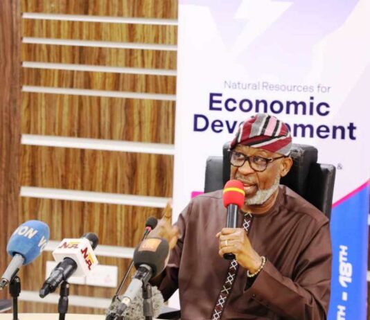 Creating Awareness on the Forthcoming Africa Natural Resources and Energy Investment Summit (3rd Edition AFNIS 2024): The Honourable Minister of Solid Minerals Development Dr Dele Alake addressing Journalists during the Press Briefing; Left: Mrs Ijeoma Idika, Director Human Resource Management Dept(Representing the Permanent Secretary); Right: Zakari Suleman Chief Executive Officer Core-I-Mine Int'l Ltd, Organizer of AFNIS Summit.