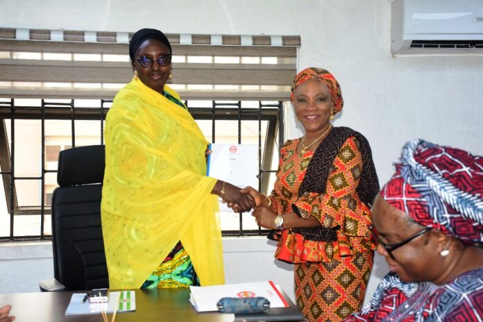 Mrs Nnenna Akajemeli, National Coordinator CEO SERVICOM Presidency Mrs Nnenna Akajemeli, National Coordinator/ CEO SERVICOM Presidency presenting the report to Ms Kachollom Daju, Permanent Secretary Federal Ministry of Health in Abuja