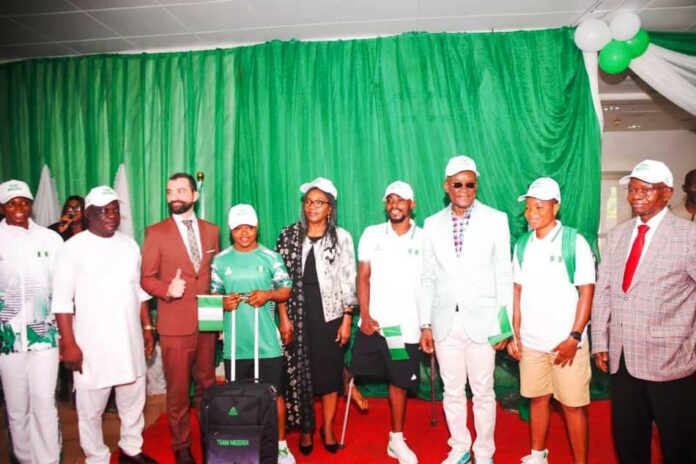 Paris 202401 Hon. Minister of Sport Development, Sen. John Owan Enoh, the Permanent Secretary, Mrs. Tinuke Watti, France de affair to Nigeria, H. E Jean-Francois Hasperue with some Nigeria athletics during the handing over and farewell ceremony of team Nigeria contingent for the Paris 2024 Olympics & Paralympic Games in Abuja on Monday
