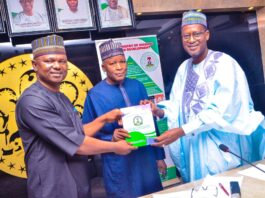 Executive Secretary, Dr James David Lulu presenting the National Accessible Regulations for Persona With Disabilities to the Honourable Minister of Housing and Urban Development, Arc Ahmed Musa Dangiwa and his State Counterpart, Abdullahi Tijjani Gwarzo when during a courtesy visit to the ministry by the National Commission for Persons With Disabilities