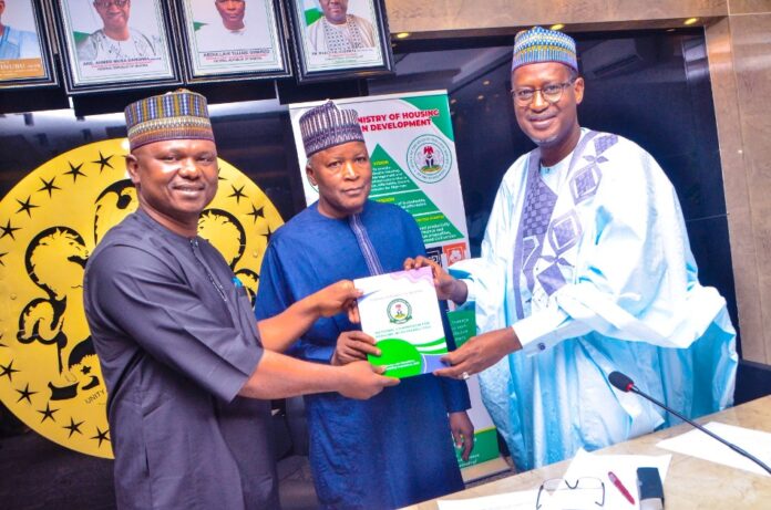 Dangiwa Executive Secretary, Dr James David Lulu presenting the National Accessible Regulations for Persona With Disabilities to the Honourable Minister of Housing and Urban Development, Arc Ahmed Musa Dangiwa and his State Counterpart, Abdullahi Tijjani Gwarzo when during a courtesy visit to the ministry by the National Commission for Persons With Disabilities