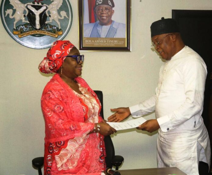 Dr Aishetu Ndayako Mohammed - Perm. Sec - EPO Perm Sec EPO, Dr. Aishetu Gogo Ndayako Mohammed receiving Handover- Notes from the Director, Pollution Control, Mr Clinton Igwe