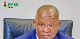 Hon minister of sports Development, John. Owan Enoh