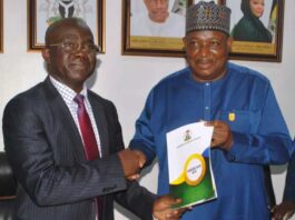 L-R: Permanent Secretary, Ministry of Police Affairs, Mr James Sule receiving the hand over Document from the immediate past Permanent Secretary of the Ministry, Dr Nasir Sani Gwarzo, during the handover and taking-over ceremony, held at the Ministry Headquarters yesterday in Abuja