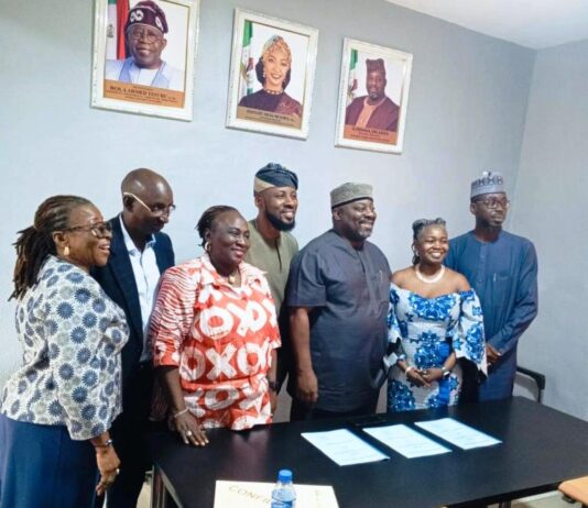 Co-founders of Mefa Abuja, Yinka and Bọlá Obebe with the Director General of the National Council for Arts and Culture, Obi Asika after the signing ceremony