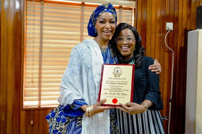 Nigerian Institute of Architects L-R: Hannatu Musa Musawa Hon. Minister of Art, Culture and the Creative Economy receiving a courtesy plaque from Adeniyi Mobolaji Fnia-Pnia the President of the Nigerian Institute of Architects (NIA) on behalf of the institute on the 9th of August 2024