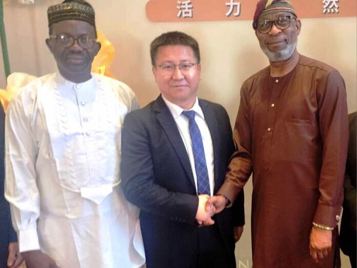 Alake Hails $1 Billion Iron Ore To Steel Project1 Minister of Solid Minerals Development, Dr. Oladele Alake welcoming the Vice Manager of SINOMACH-HE, Hou Encai and Chief Executive Officer, Chart & Capstone Integrated Nigeria Limited, Chief Abel Edijala to the meeting at The Peninsula, Beijing, China recently.