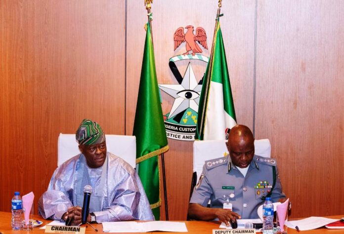 HM Wale Edun with the Comptroller General of the Nigeria Customs Service Mr Bashir Adewale Adeniyi during the pivotal meeting of the NCS Board, in Abuja